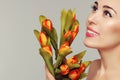 Spring model shooting. Young woman with flowers tulips. Fashion Royalty Free Stock Photo