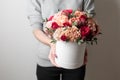 Beautiful luxury bouquet of mixed flowers in woman hand. the work of the florist at a flower shop. Horizontal photo Royalty Free Stock Photo