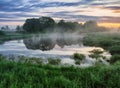 Morning. a picturesque foggy dawn by the river. Sun rays Royalty Free Stock Photo