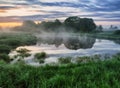 Morning. a picturesque foggy dawn by the river. Sun rays Royalty Free Stock Photo