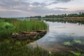 Spring morning on the river Southern Bug. There is a wooden boat