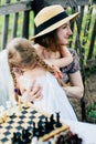 In the spring, mother and daughter spend too much time in the apple orchard. Happy family concept Royalty Free Stock Photo