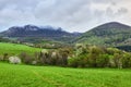 Spring mountain landscape with big rock after rain. Royalty Free Stock Photo