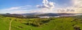 Spring mountain panorama. Lake Czorsztyn on Dunajec river. Village in green forest and meadow hills Royalty Free Stock Photo