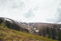 Spring in mountains. Beautiful mountain landscape with snow on the north slope Royalty Free Stock Photo