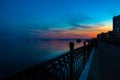 Spring night city Saratov quay under sunset. Street decorative lights and beautiful sky Royalty Free Stock Photo