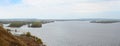 spring panorama of a wide river , islands on a cloudy day Royalty Free Stock Photo