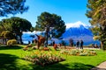 Spring park with flowerbeds and sea animals grass sculptures at riviera of Lake Geneva in Montreux, Switzerland