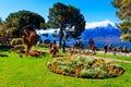 Spring park with flowerbeds and sea animals grass sculptures at riviera of Lake Geneva in Montreux, Switzerland