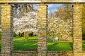 Spring in the park. View true stone Window Royalty Free Stock Photo