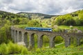 Spring photo of the Novinsky viaduct with the train