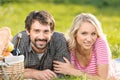 Spring picnic. Loving young couple enjoying a romantic picnic in Royalty Free Stock Photo