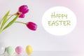 Spring pink tulip flowers with Easter eggs on pink background Royalty Free Stock Photo