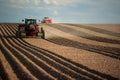 A farmer planting potatoes in an Idaho farm field. Royalty Free Stock Photo