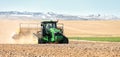 Spring Planting of potatoes in an Idaho farm field. Royalty Free Stock Photo