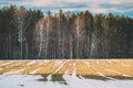 Spring Plowed Field Partly Covered Winter Melting Snow Ready For New Season. Ploughed Field In Early Spring. Farm Royalty Free Stock Photo