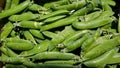 Pods of young green peas close up at the farmers market Royalty Free Stock Photo