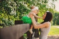 Spring portrait of mother and baby daughter playing outdoor in matching outfit - long skirts and shirts Royalty Free Stock Photo