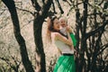 Spring portrait of mother and baby daughter playing outdoor in matching outfit - long skirts and shirts