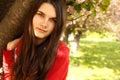 Spring portrait teen girl near Japanese cherry tree Royalty Free Stock Photo