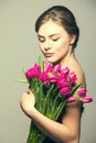 Spring portrait of young beautifull woman with tulip flowers