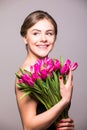 Spring portrait of young beautifull woman with tulip flowers