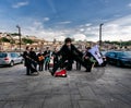 Spring in Portugal. Performances of students-musicians on the embankment of the Duoro River in the old city of Porto