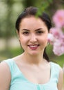 spring positive cheerful young female portrait in garden