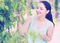 Spring positive smiling young female portrait in garden