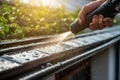 Spring Rain Gutters Cleaning Using Pressure Washer AI generated Royalty Free Stock Photo