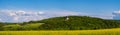 Spring rapeseed yellow blooming fields view  blue sky with clouds in sunlight panorama. Pyatnychany tower Royalty Free Stock Photo