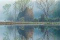 Spring Reflections Deep Lake in Fog Royalty Free Stock Photo