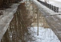 Spring road flooded with meltwater