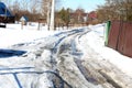 spring road trees houses snow