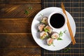 Spring roll with nori, sushi rice, salmon, cucumber and avocado, sriracha Royalty Free Stock Photo