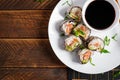 Spring roll with nori, sushi rice, salmon, cucumber and avocado, sriracha Royalty Free Stock Photo