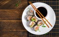 Spring roll with nori, sushi rice, salmon, cucumber and avocado, sriracha Royalty Free Stock Photo