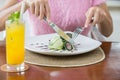 Woman eat crunchy tuna spring roll with cucumber ice cream. Mole Royalty Free Stock Photo