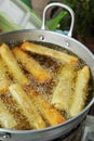 Spring rolls, fried in a pan. Royalty Free Stock Photo