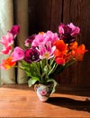 Spring romantic bouquet with garden colorful tulips in the interior Royalty Free Stock Photo