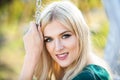 Spring romantic casual blonde romantic woman portrait. Woman with romantic smile. Young woman on sunny summer day Royalty Free Stock Photo