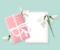 Spring rose gift box with white snowdrops. Place for text