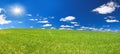 Spring rural landscape with field and blue sky, a panorama Royalty Free Stock Photo