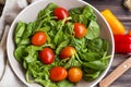 Spring salad closeup with fresh green rocket, spinach leaves and Royalty Free Stock Photo