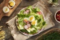 Spring salad with eggs and wild edible plants - chickweed, nipplewort and yarrow Royalty Free Stock Photo
