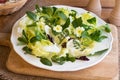 Spring salad with primula, nipplewort and other wild edible plan Royalty Free Stock Photo