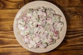 Spring salad with radish, dill and green onions and sour cream