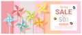 Spring sale banner with colorful pinwheels