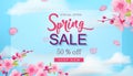 Spring sale banner with flowers, blue sky, hand drawn floral design elements. Royalty Free Stock Photo