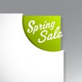 Spring Sale text uncovered from torn paper corner.